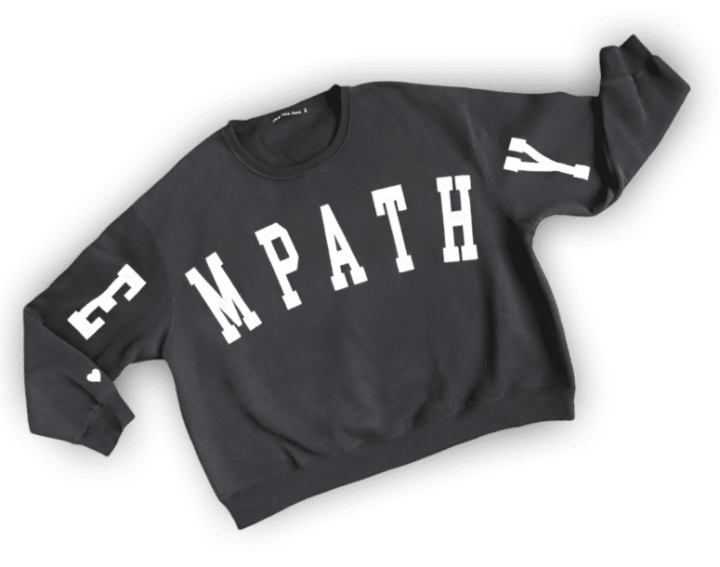 Black sweatshirt with "EMPATHY" in white letters.